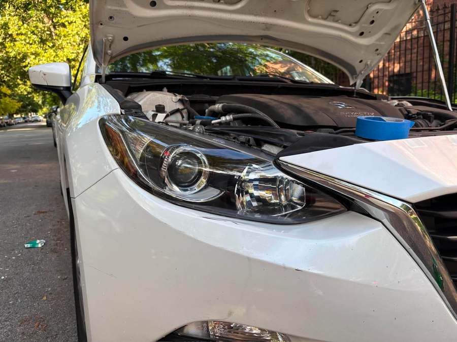 Fully clear headlight lens on the same Mazda after restoration