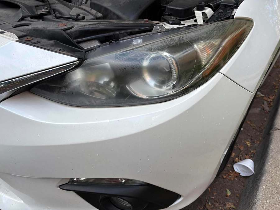 Hazed passenger side headlight before restoration