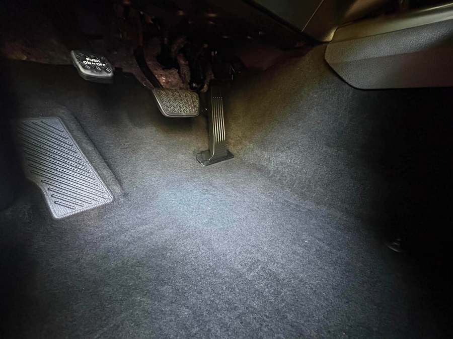 Driver footwell vacuumed and groomed after cleaning