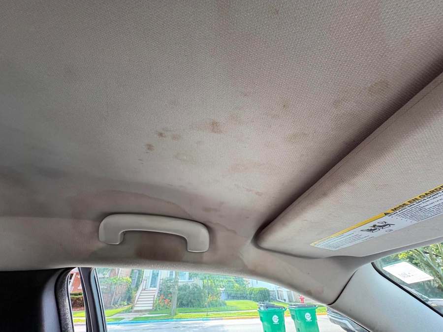 Stained fabric headliner before treatment