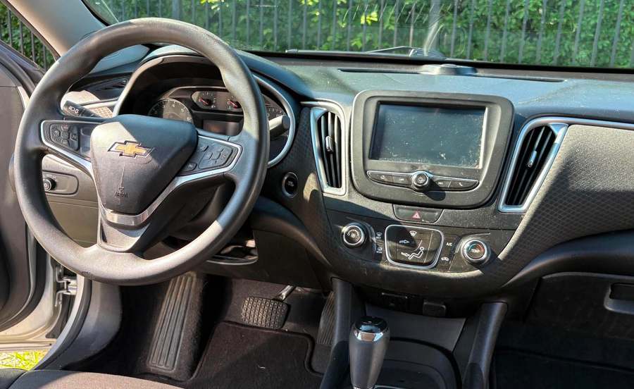 Dusty Malibu dashboard, vents and touchscreen before the interior detail